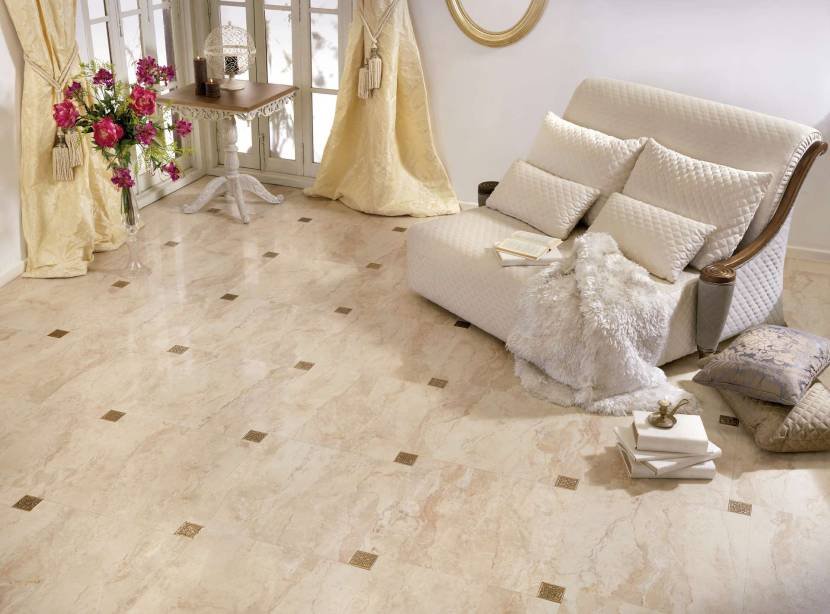 Cream marble-effect floor tile with decorative inserts in a bright living room
