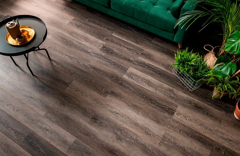 Dark wood-effect plank tile laid across a living room floor
